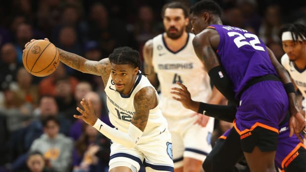 Dec 23, 2022; Phoenix, Arizona, USA; Memphis Grizzlies guard Ja Morant (12) against the Phoenix Suns in the first half at Footprint Center.